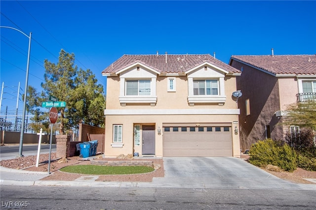 view of front of property featuring a garage, driveway, a tile roof, and stucco siding