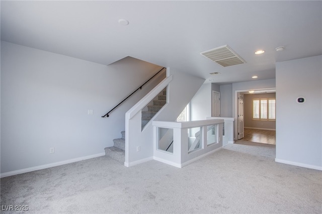 stairs with baseboards, visible vents, carpet flooring, and recessed lighting