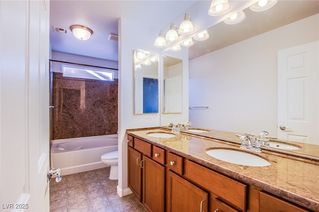 full bathroom with toilet, visible vents, and a sink