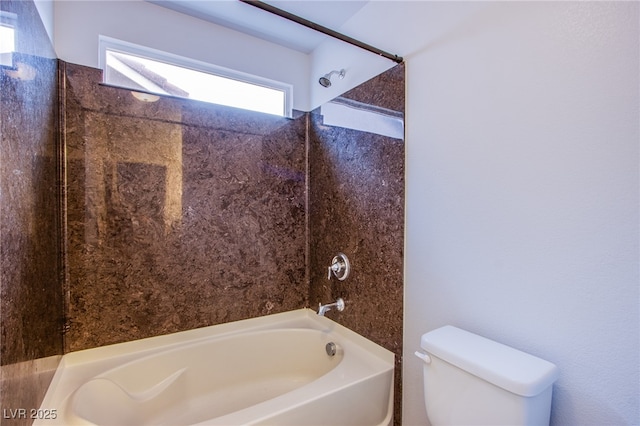 bathroom featuring toilet and bathtub / shower combination