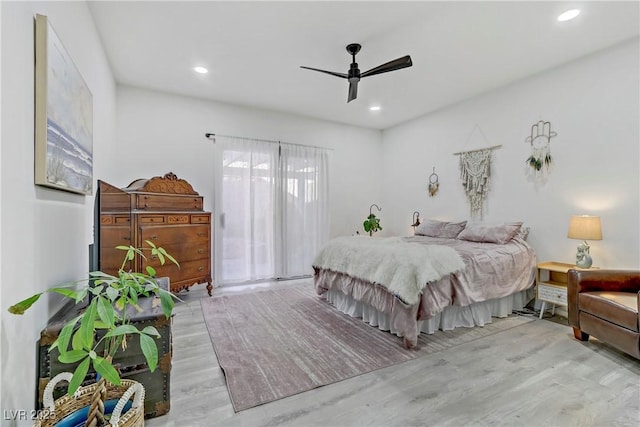 bedroom with light wood-style flooring and recessed lighting