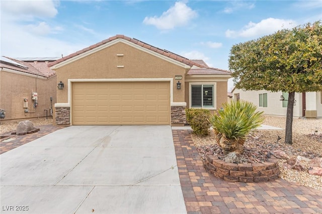 view of front of house with stucco siding, stone siding, a garage, and concrete driveway