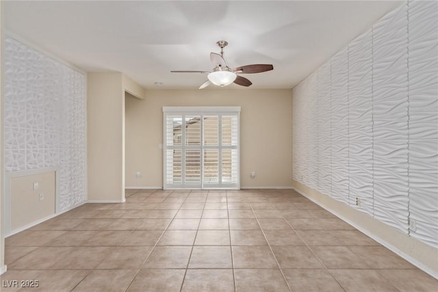 unfurnished room with light tile patterned flooring, baseboards, and a ceiling fan