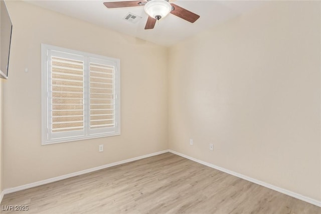 unfurnished room with light wood-style flooring, baseboards, visible vents, and ceiling fan