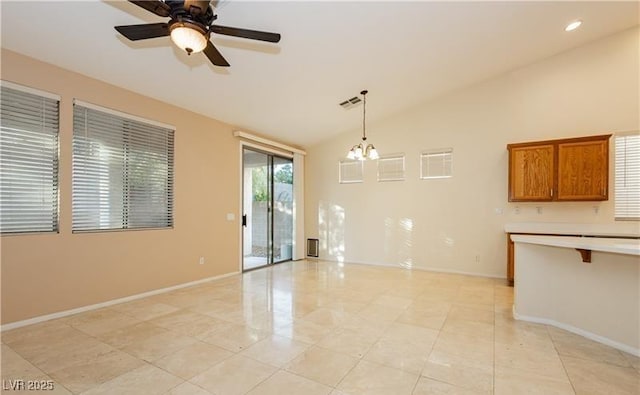 interior space with visible vents, baseboards, lofted ceiling, ceiling fan with notable chandelier, and recessed lighting