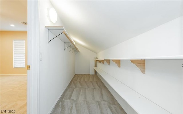 bonus room featuring recessed lighting, light colored carpet, visible vents, vaulted ceiling, and baseboards