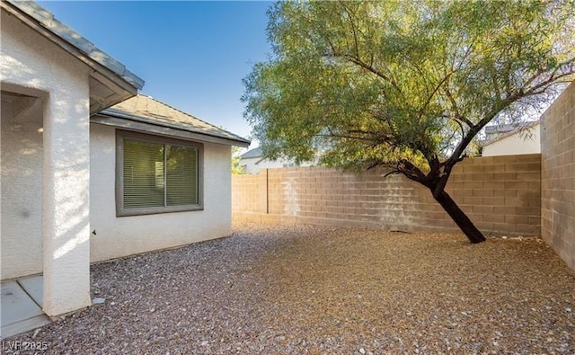 view of yard with a fenced backyard