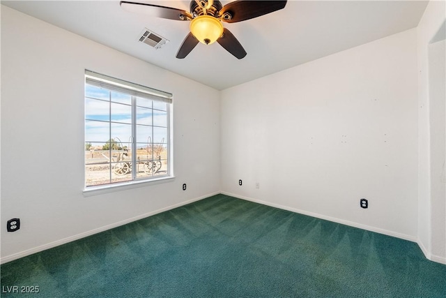 carpeted spare room featuring visible vents, ceiling fan, and baseboards