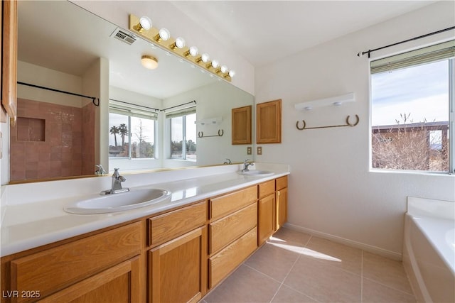 full bath with tile patterned flooring, visible vents, a sink, and a bath