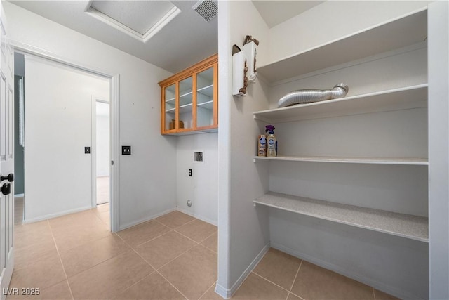 laundry area featuring laundry area, attic access, visible vents, tile patterned flooring, and washer hookup