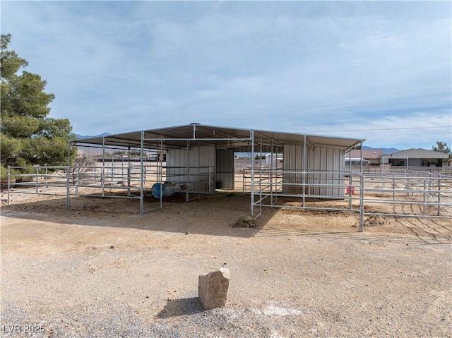 view of outdoor structure featuring an exterior structure, an outbuilding, and a carport
