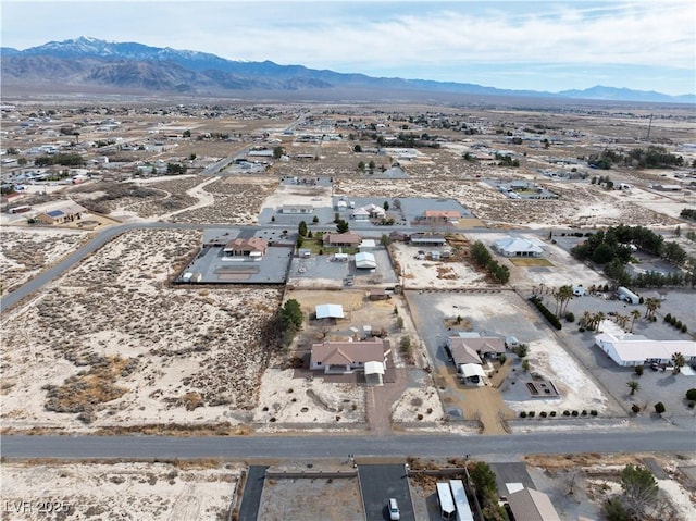 bird's eye view featuring a mountain view and a desert view