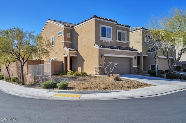 view of front of property with driveway, a garage, a tiled roof, fence, and stucco siding