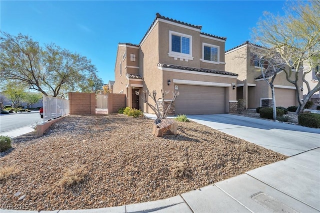 view of front of property with an attached garage, fence, driveway, a tiled roof, and stucco siding