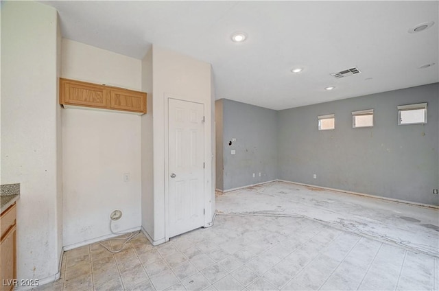 unfurnished room with visible vents and recessed lighting