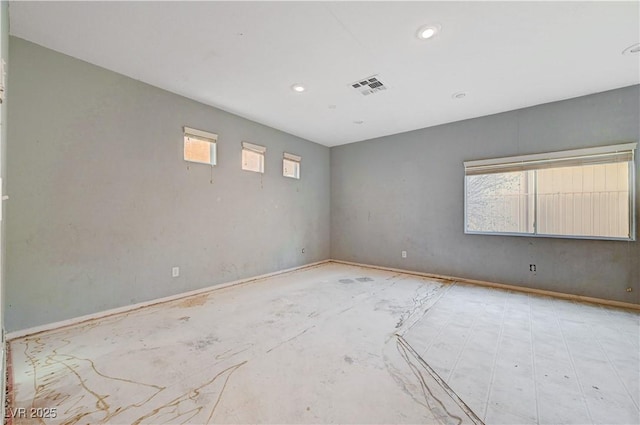 spare room featuring visible vents and recessed lighting