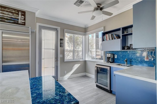 kitchen with ornamental molding, beverage cooler, visible vents, and open shelves