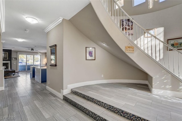 interior space with baseboards and stairs