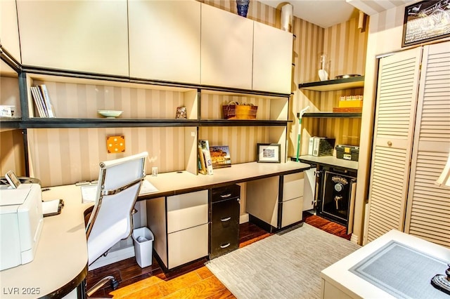 office area featuring built in study area and light wood-style flooring