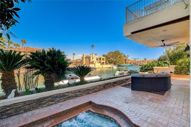 view of patio / terrace with a ceiling fan, an outdoor living space, and a balcony