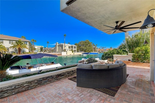 view of patio featuring ceiling fan and an outdoor pool