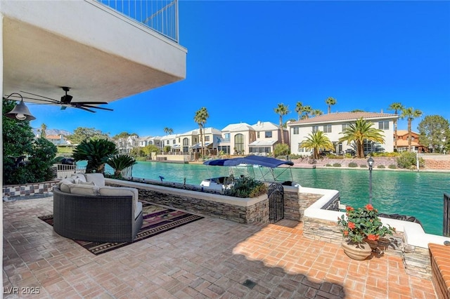 view of pool featuring ceiling fan, a patio, and a residential view