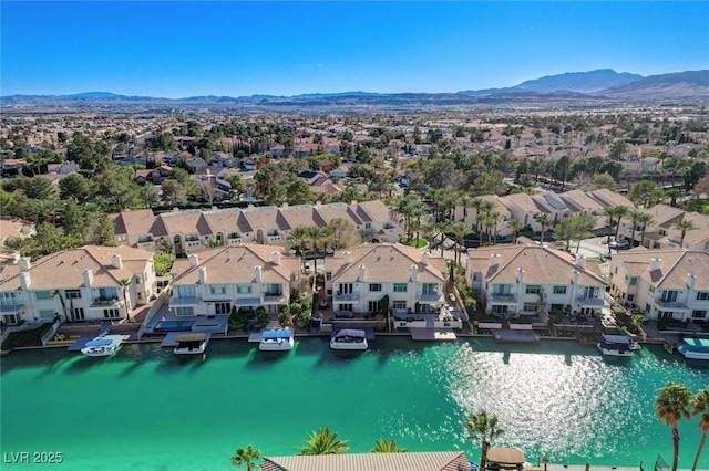 aerial view featuring a residential view and a water and mountain view