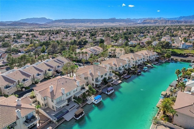 birds eye view of property with a residential view and a water and mountain view