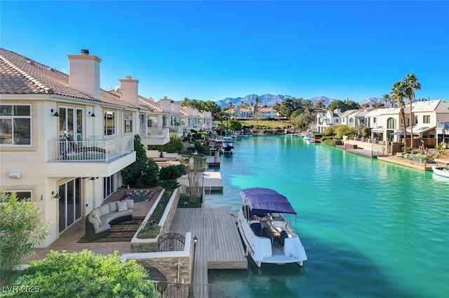 dock area with a residential view and a mountain view