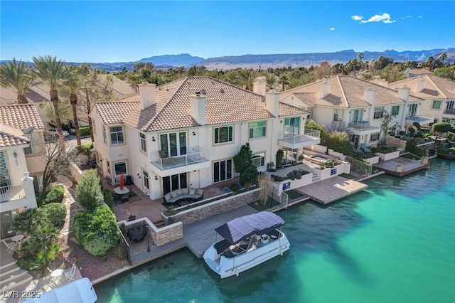 bird's eye view featuring a residential view and a water and mountain view