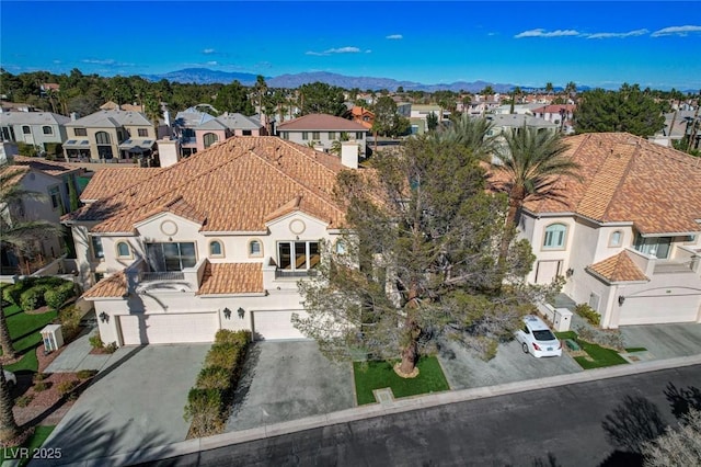 birds eye view of property featuring a residential view and a mountain view