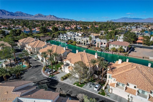 drone / aerial view featuring a residential view and a mountain view