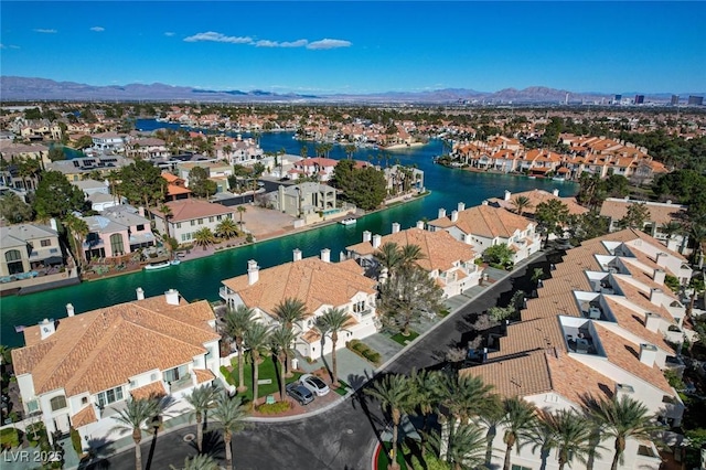 birds eye view of property with a residential view and a water and mountain view