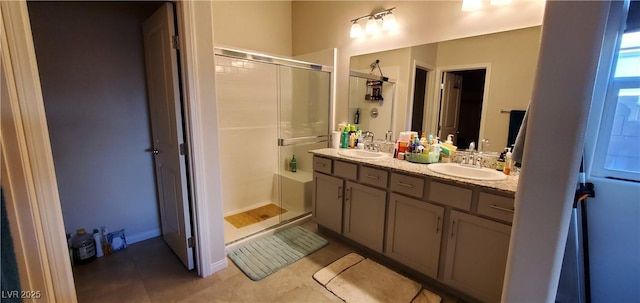 7910 Shimmery St, North Las Vegas, NV 89084 - bathroom featuring a shower stall, tile patterned floors, and double vanity