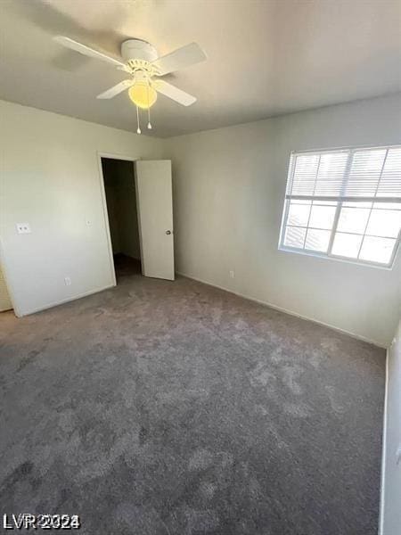 unfurnished bedroom featuring carpet floors and ceiling fan