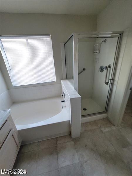 full bath featuring vanity, a shower stall, and a bath