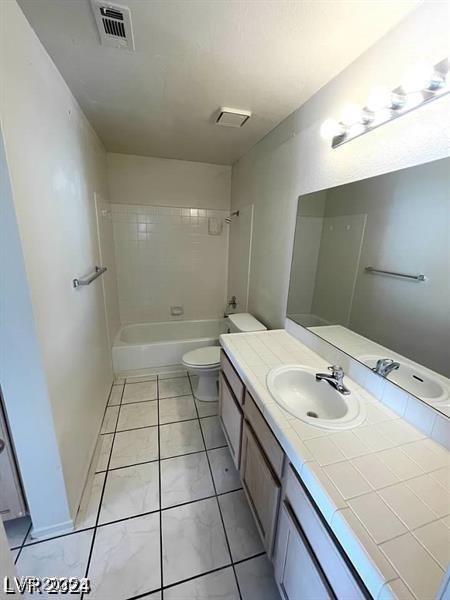 bathroom featuring toilet, visible vents, tub / shower combination, and vanity