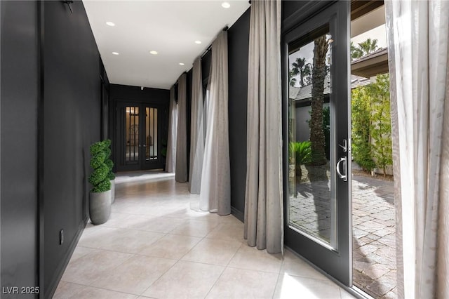 hall with recessed lighting, french doors, and light tile patterned floors