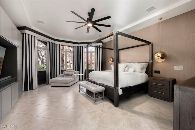 bedroom featuring a ceiling fan, visible vents, and light tile patterned floors