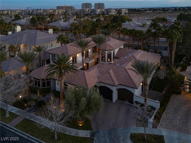 birds eye view of property featuring a city view