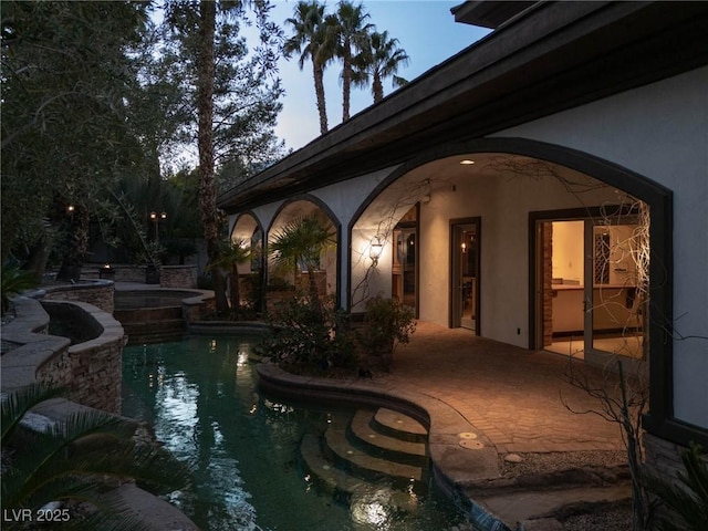 outdoor pool featuring a patio area