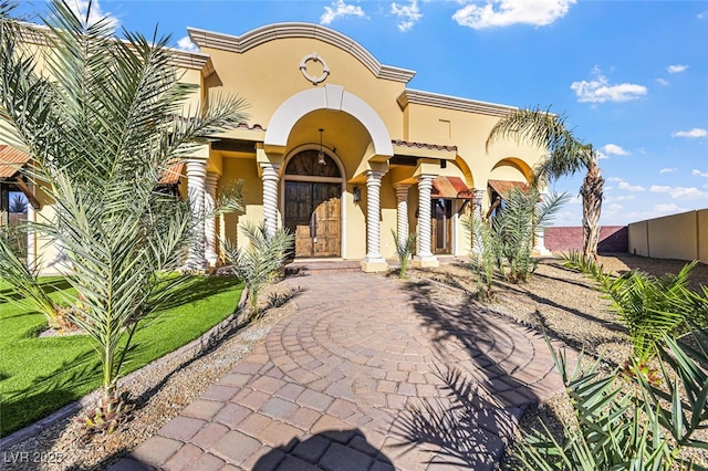 mediterranean / spanish-style house with stucco siding