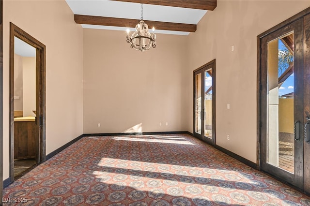 spare room with baseboards, a chandelier, and beamed ceiling