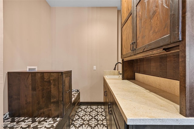 bathroom with baseboards and vanity