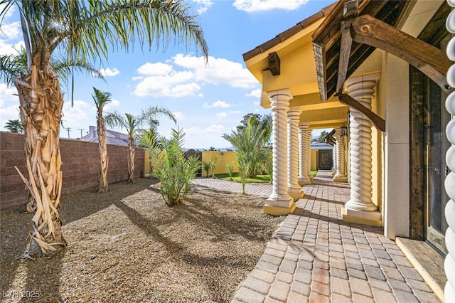 view of yard featuring a patio area and a fenced backyard