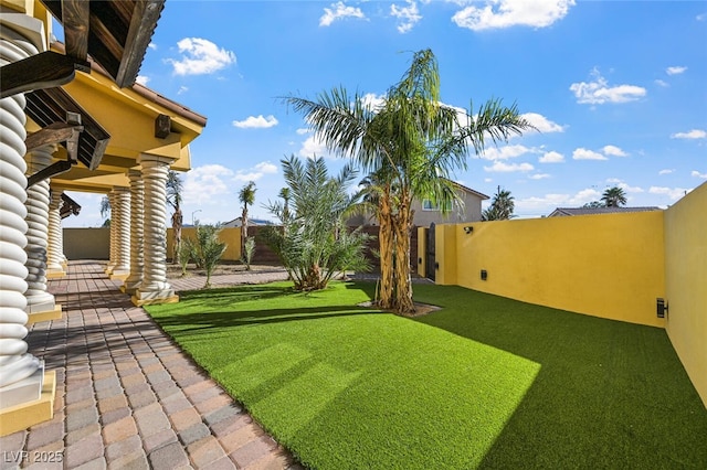 view of yard featuring a patio area and fence