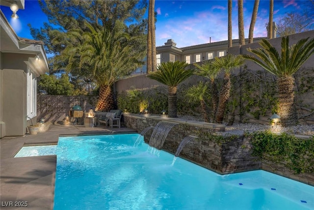 view of swimming pool featuring a fenced backyard