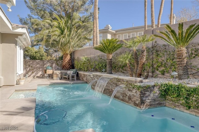 view of swimming pool with a patio and a fenced backyard