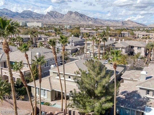 birds eye view of property with a residential view and a mountain view