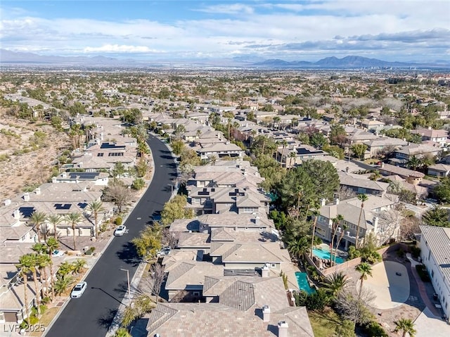 birds eye view of property with a residential view and a mountain view